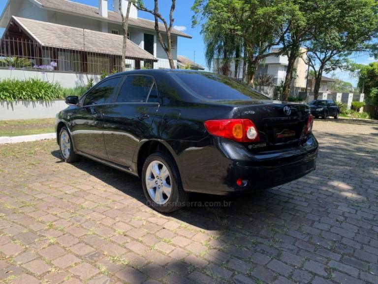 TOYOTA - COROLLA - 2010/2011 - Preta - R$ 59.000,00